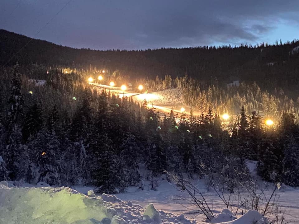 Image of salmo ski hill at night with the lights shining