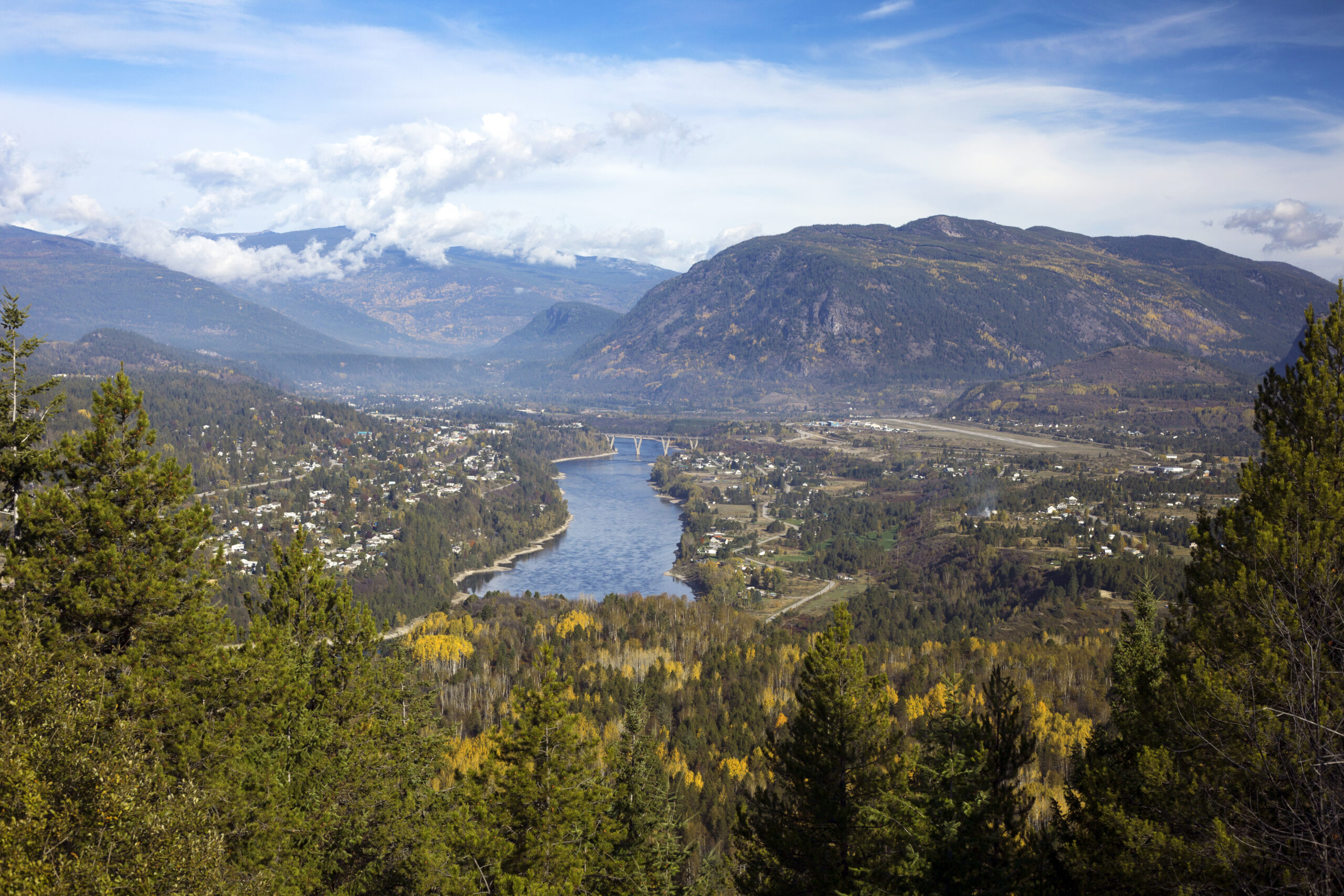 Aerial image of Castlegar, BC nestled in the Selkirk Mountains with the Columbia River visible